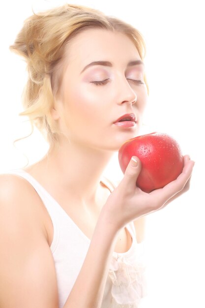 Blond woman with an apple