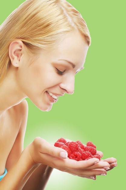 Blond woman with raspberries