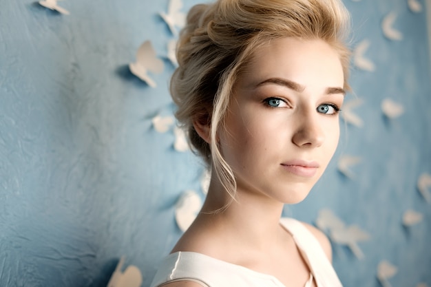 Blond young woman beauty portrait, make up