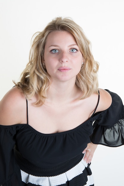 Blond young woman with a black and white dress