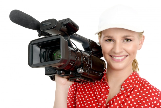 Blond young woman with professional video camcorder