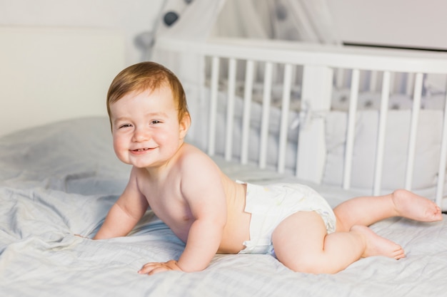 Photo blonde baby wearing diaper