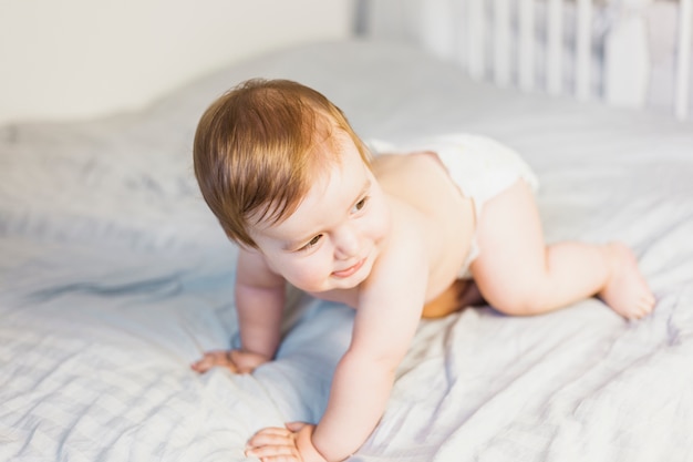 Photo blonde baby wearing diaper