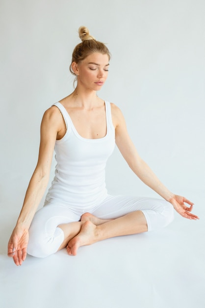 blonde beautiful cheerful woman doing yoga asanas healthy lifestyle and sport concept