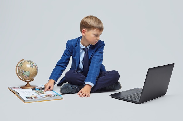 Blonde boy on a gray background