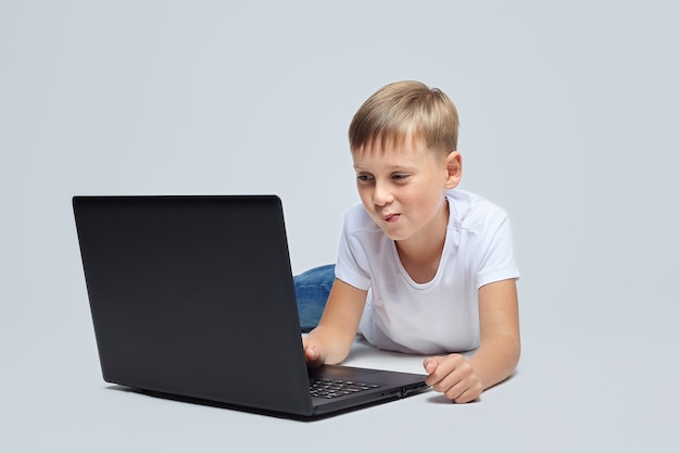 Blonde boy on a gray background