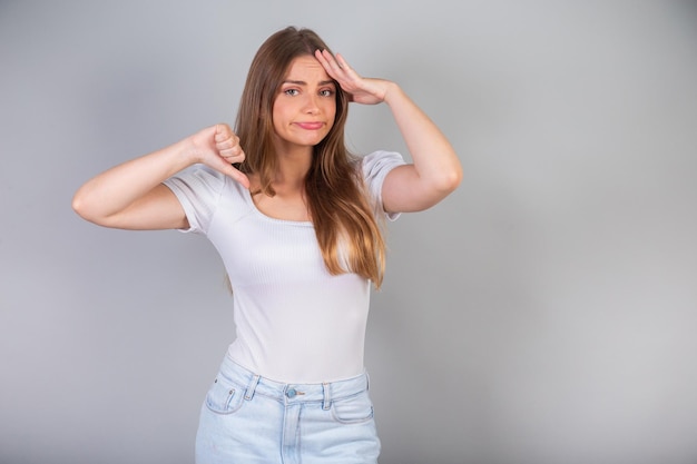 Blonde Brazilian woman sign of dislike thumb down