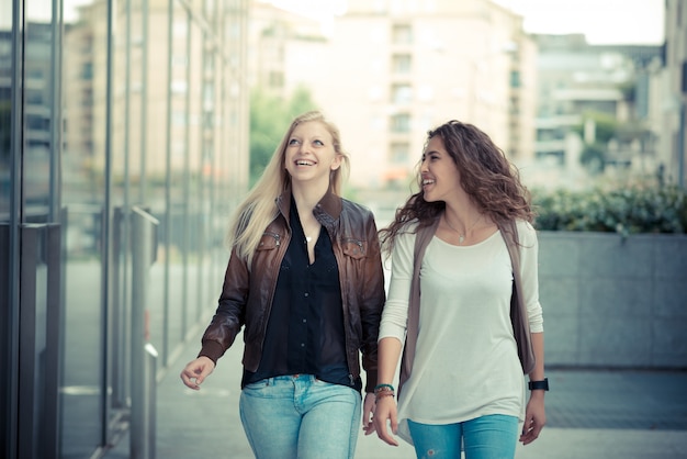 blonde and brunette beautiful stylish young women