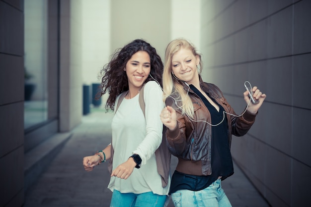 blonde and brunette beautiful stylish young women