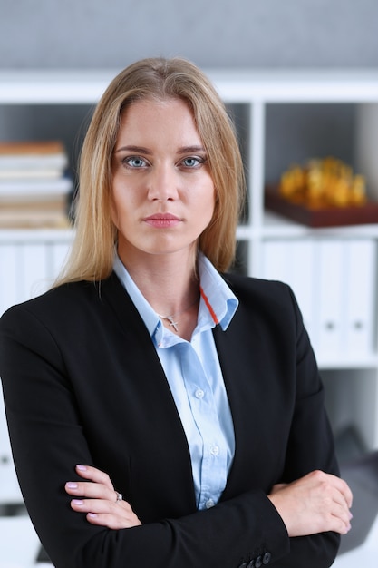 Blonde business woman portrait in office