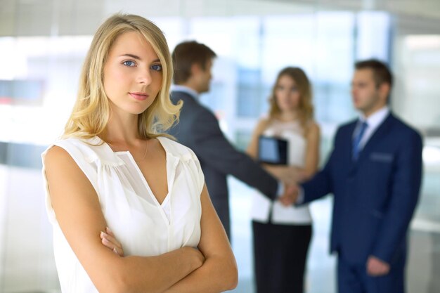 Blonde businesswoman looking at camera