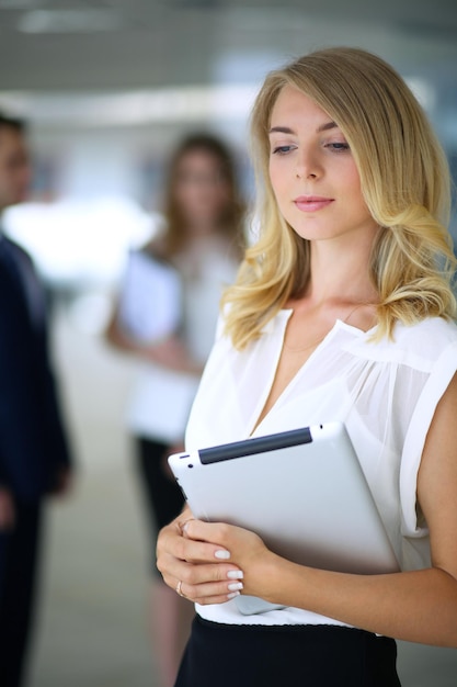 Blonde businesswoman looking at camera