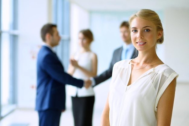 Blonde businesswoman looking at camera