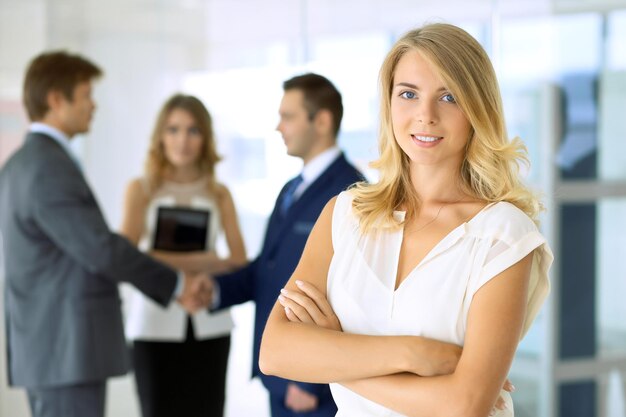 Blonde businesswoman looking at camera