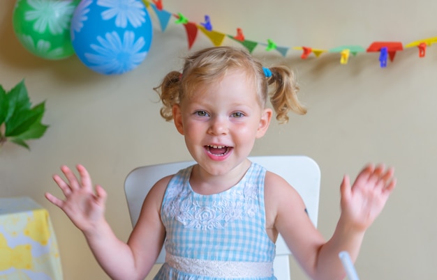 Blonde, Caucasian girl smartly dressed and smiling