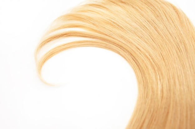 Blonde Curls hair isolated. strand of blonde hair, hair care, hair care