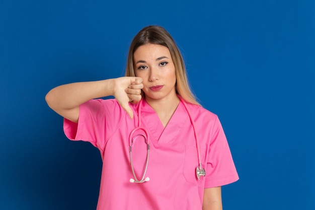 Blonde doctor with pink uniform