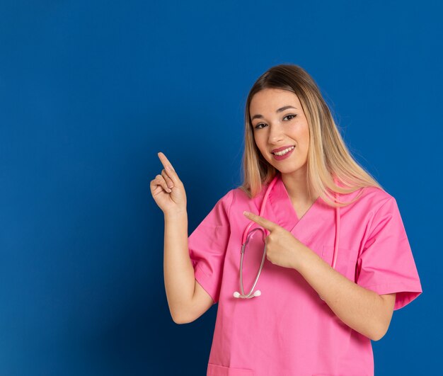 Blonde doctor with pink uniform