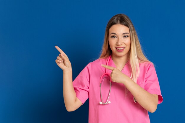 Blonde doctor with pink uniform