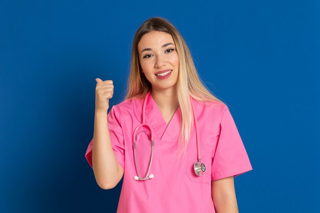 Blonde doctor with pink uniform