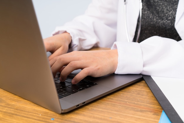 Blonde doctor woman with her laptop