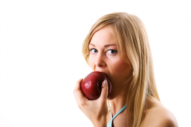 blonde girl eating apple