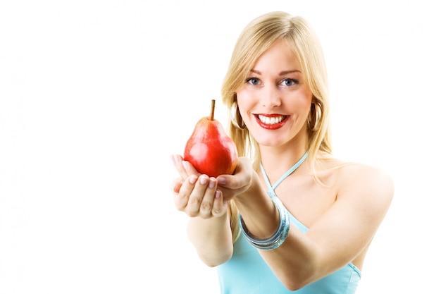 blonde girl holding pear