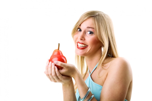 blonde girl holding pear