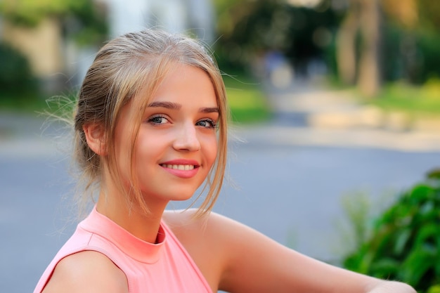 Blonde girl in pink shirt