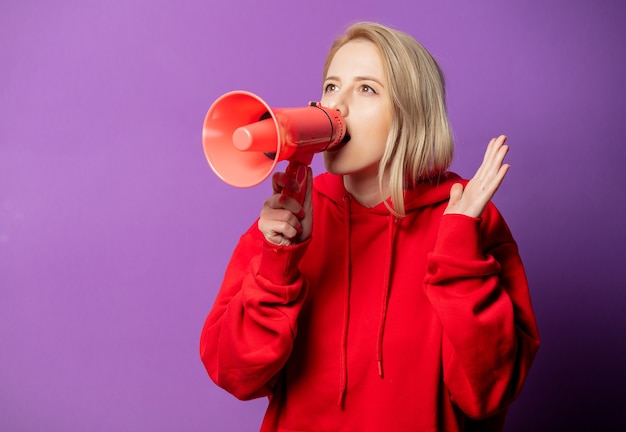 Blonde girl in red sweatshirt