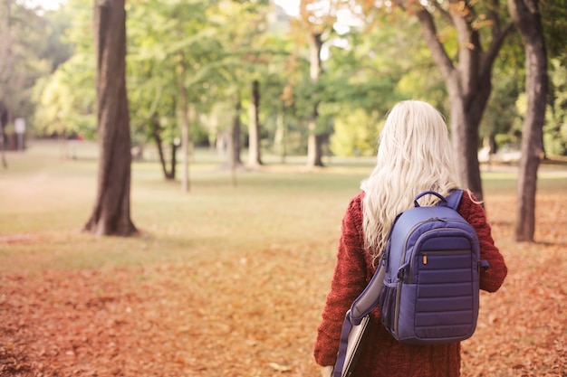 Blonde girl with a backpack