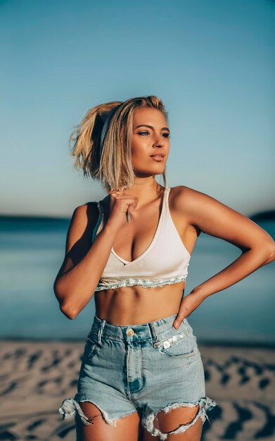 blonde girl with a croptop and hotpant
