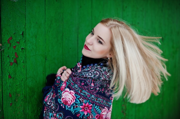 Blonde girl with hand embroidered scarf posed at winter day. Women's handkerchief.