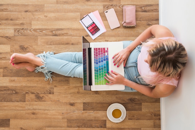 Blonde influencer using laptop