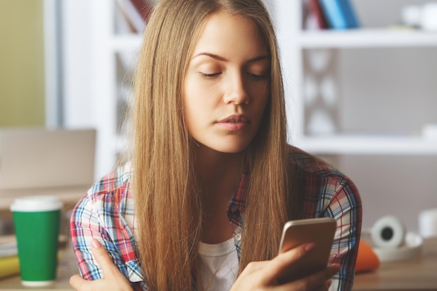 Blonde lady using mobile phone