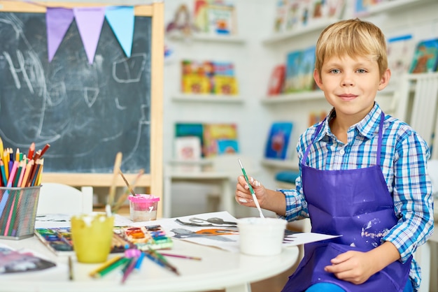 Blonde Little Boy Posing in Art Studio