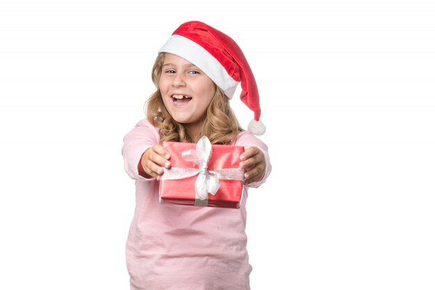 Blonde little girl with a gift on white background