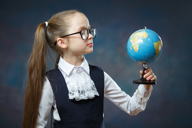 Blonde Little Schoolgirl Hold World Globe in Hand