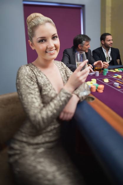 Blonde looking up from roulette table