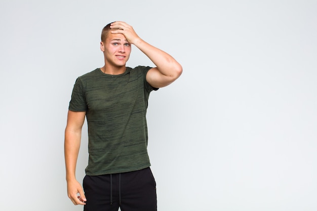 Blonde man panicking over a forgotten deadline