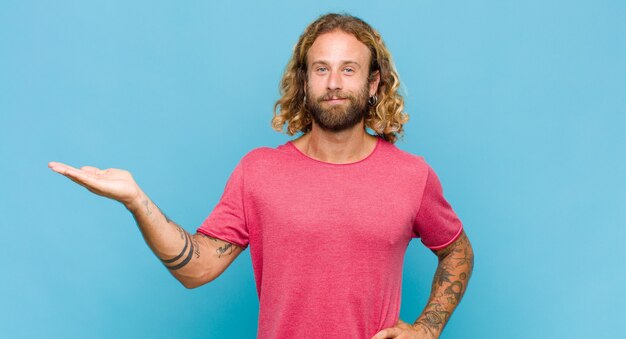 Blonde man smiling and feeling confident