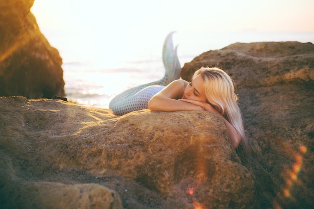 Blonde in a mermaid costume