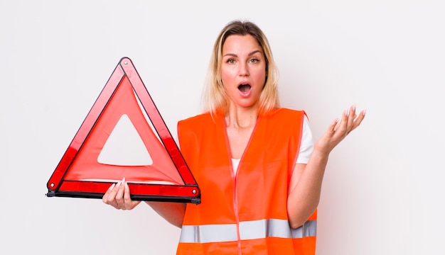 Blonde pretty woman feeling extremely shocked and surprised car triangle accident concept