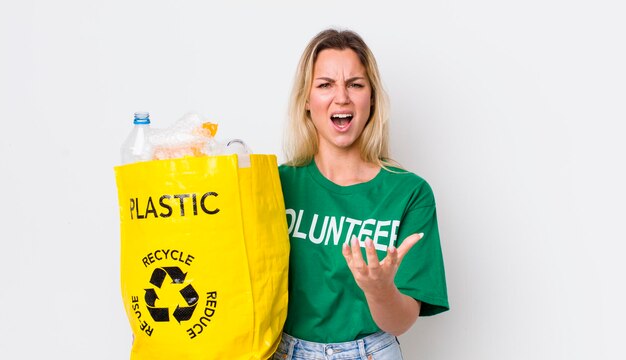 Blonde pretty woman looking angry annoyed and frustrated recycle concept