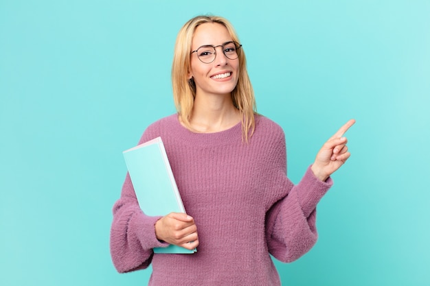 Blonde pretty woman with books studing