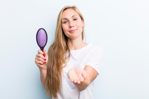 Blonde pretty woman with a hair comb