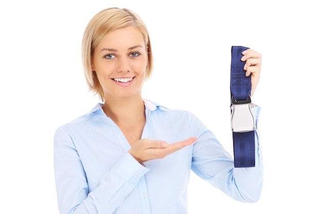 Blonde stewardess in blue shirt showing belt over white