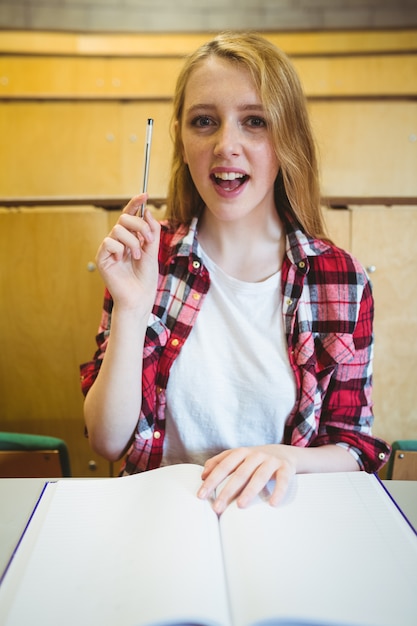 Blonde student asking a question during class