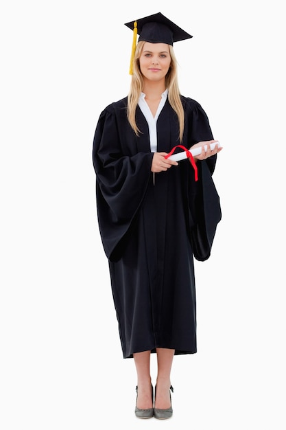 Photo blonde student in graduate robe holding her diploma