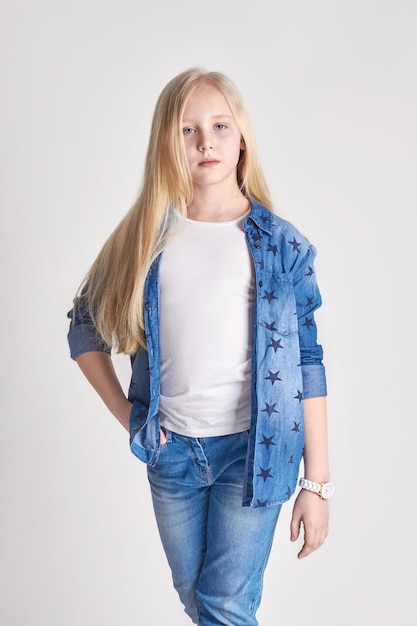 Blonde teenager in a denim outfit